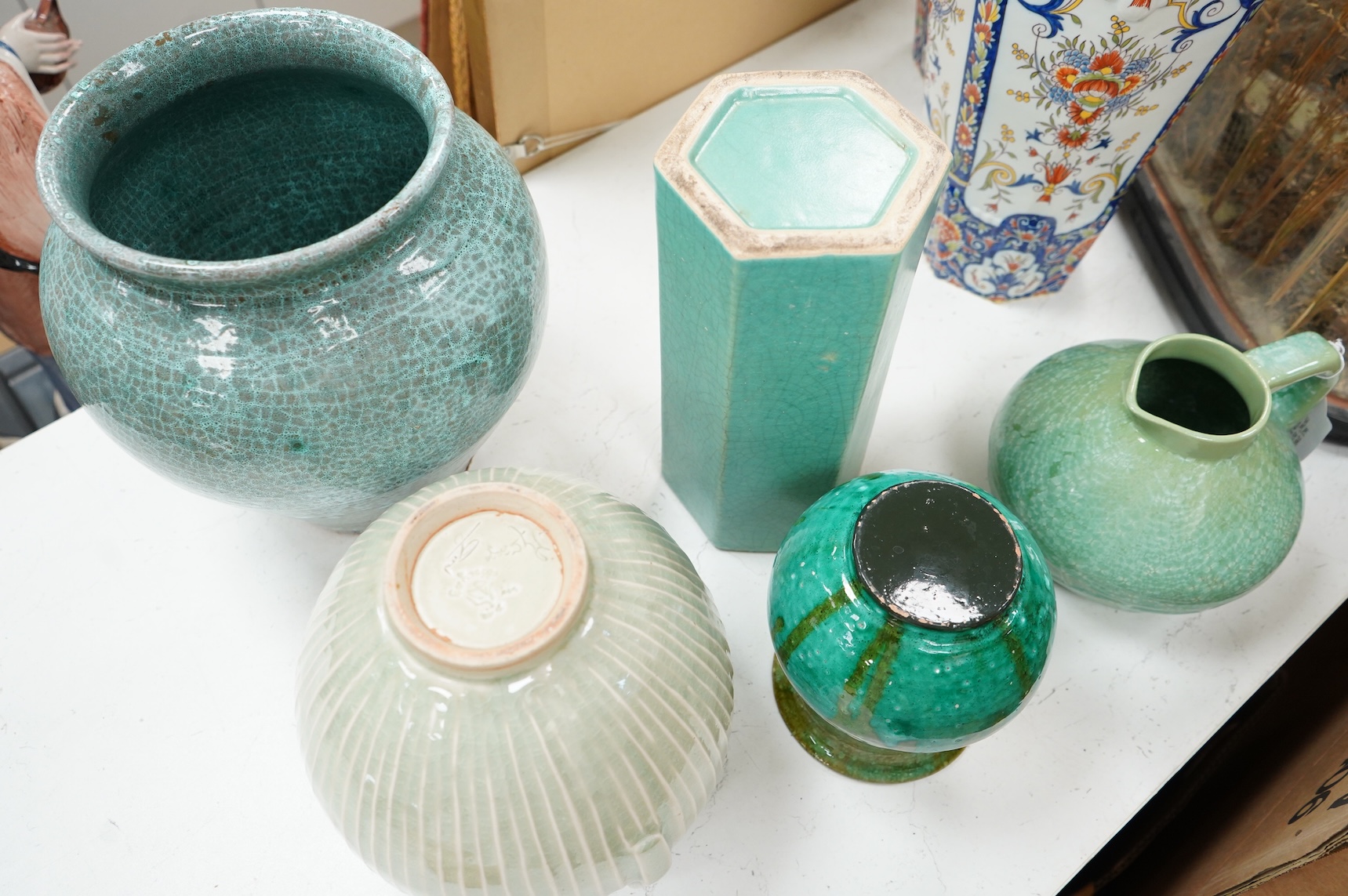 A group of Continental green glazed earthenware vessels including a crystal glazed jug, largest 29cm high